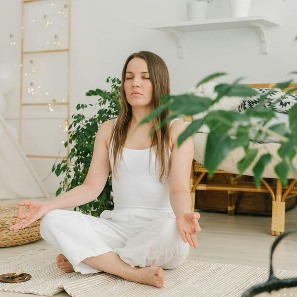 Person sitting in a lotus pose finding inner peace